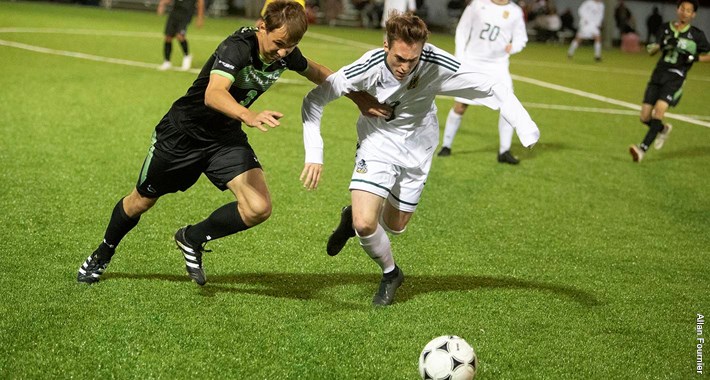 Centennial's Rodion Matveev and Durham's Sheldon Holden fight for the ball during action at Vaso's Field between the two teams, in which the game ended in a 2-2 tie (Allan Fournier: Durham College)