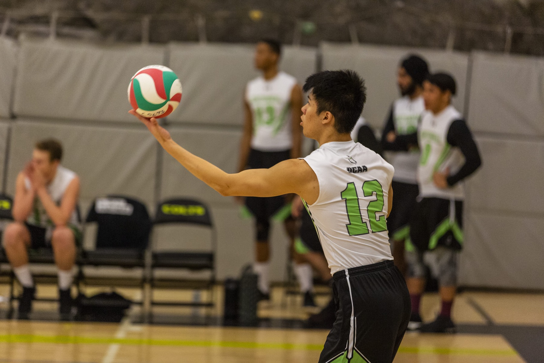 Timothy Ho of the Centennial Colts gets ready to serve during game action at the Athletic and Wellness Centre between the Colts and the Canadore Panthers. (John Theurer/Colts Media)