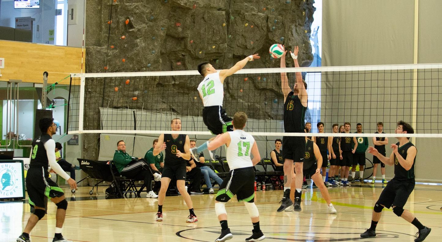 Timothy Ho of the Centennial Colts goes up for the kill as Joel Howes of the Fleming Knights tries to thwart his attempt during game action at the Athletic and Wellness Centre between the two teams. (Nicole Ventura/Colts Media)