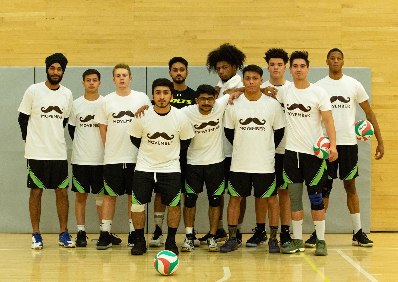 The men's team poses in their Movember shirts just before tip off against the George Brown Huskies on Thursday night. (Nicole Ventura/Colts Media)
