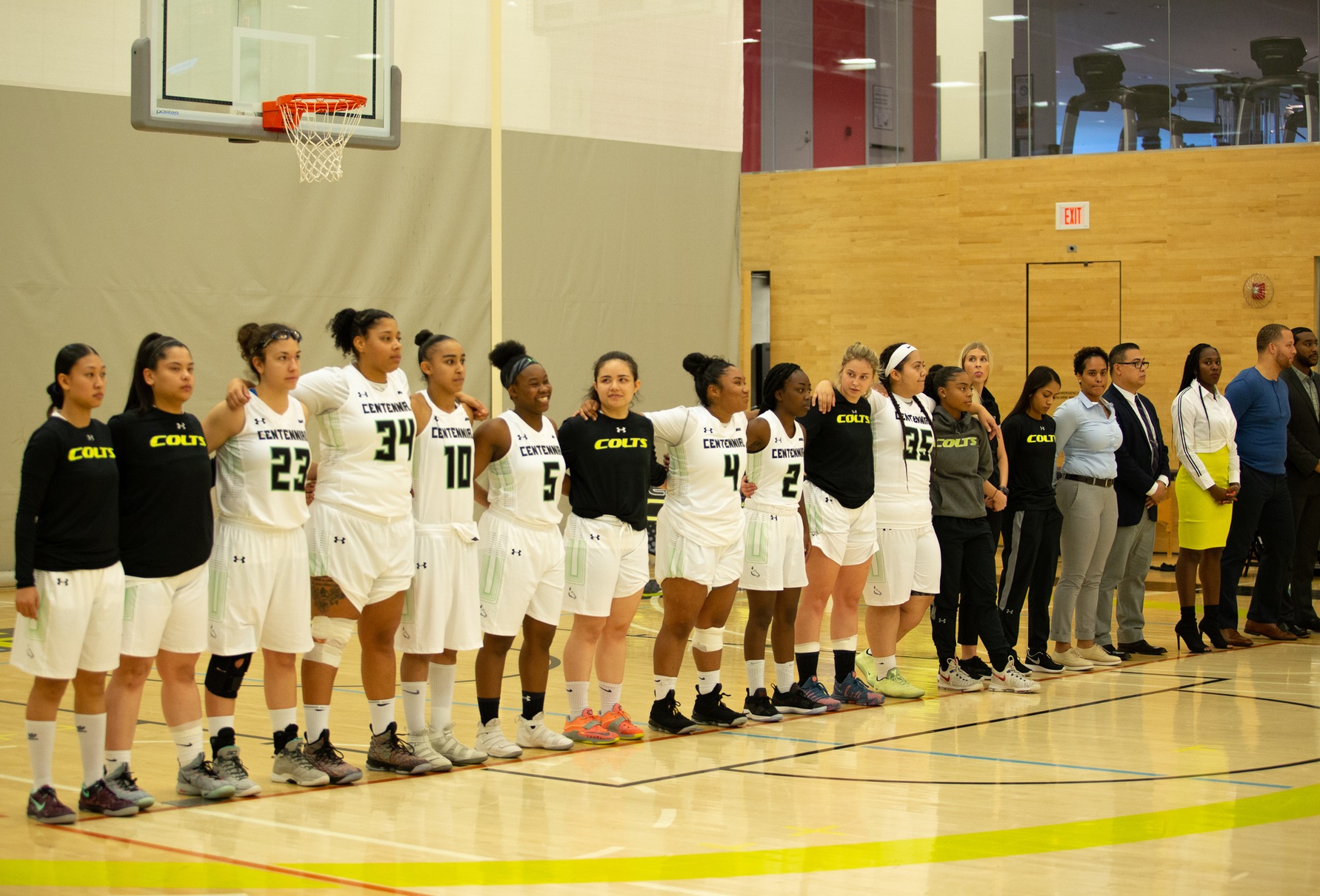 The Lady Colts stand side by side as the national anthem is played prior to their home opener. (Nicole Ventura/Colts Media)