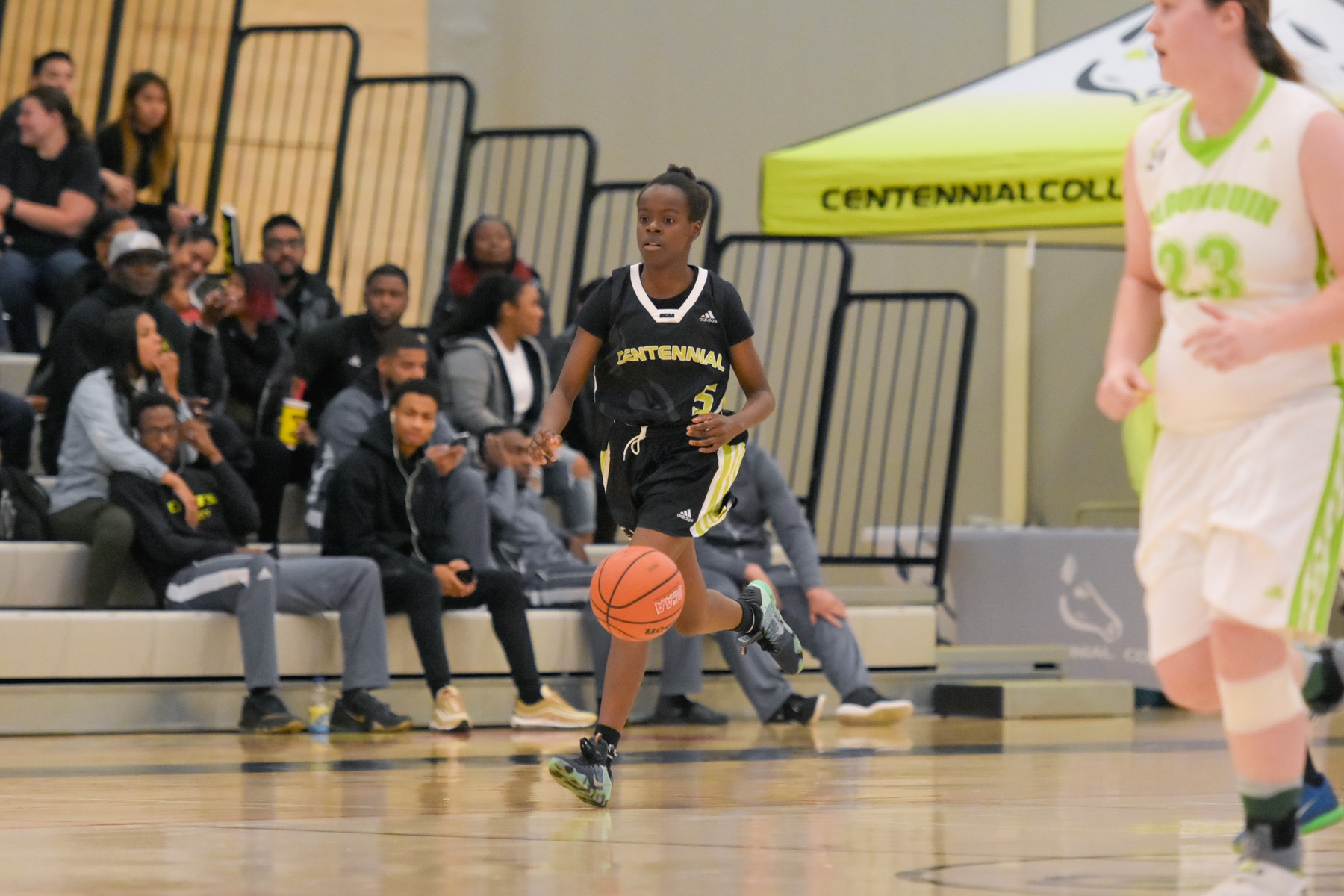 Centennial Colts guard Mariam Konate dribbles the ball in transition after committing one of her seven steals in the game. The Colts took care of work in their home opener, beating the Algonquin Thunder, 57-36, at Athletic and Wellness Centre. (Yvano Antonio/ Colts Athletics)